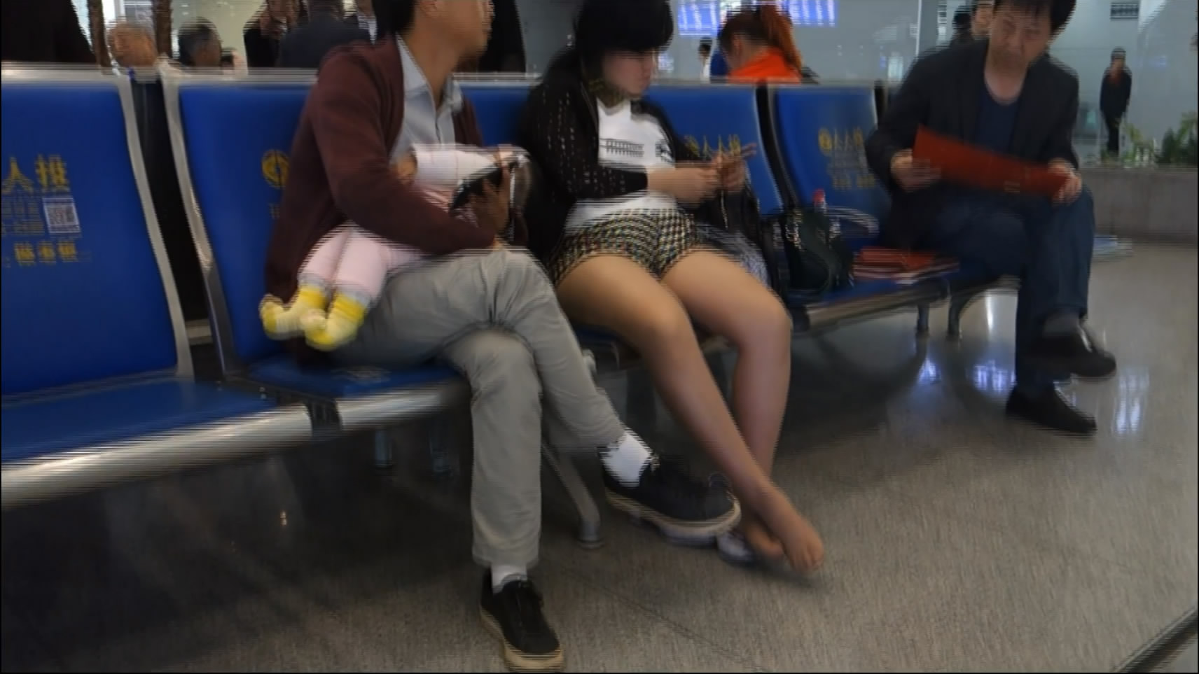 waiting at the airport wearing nylon feet